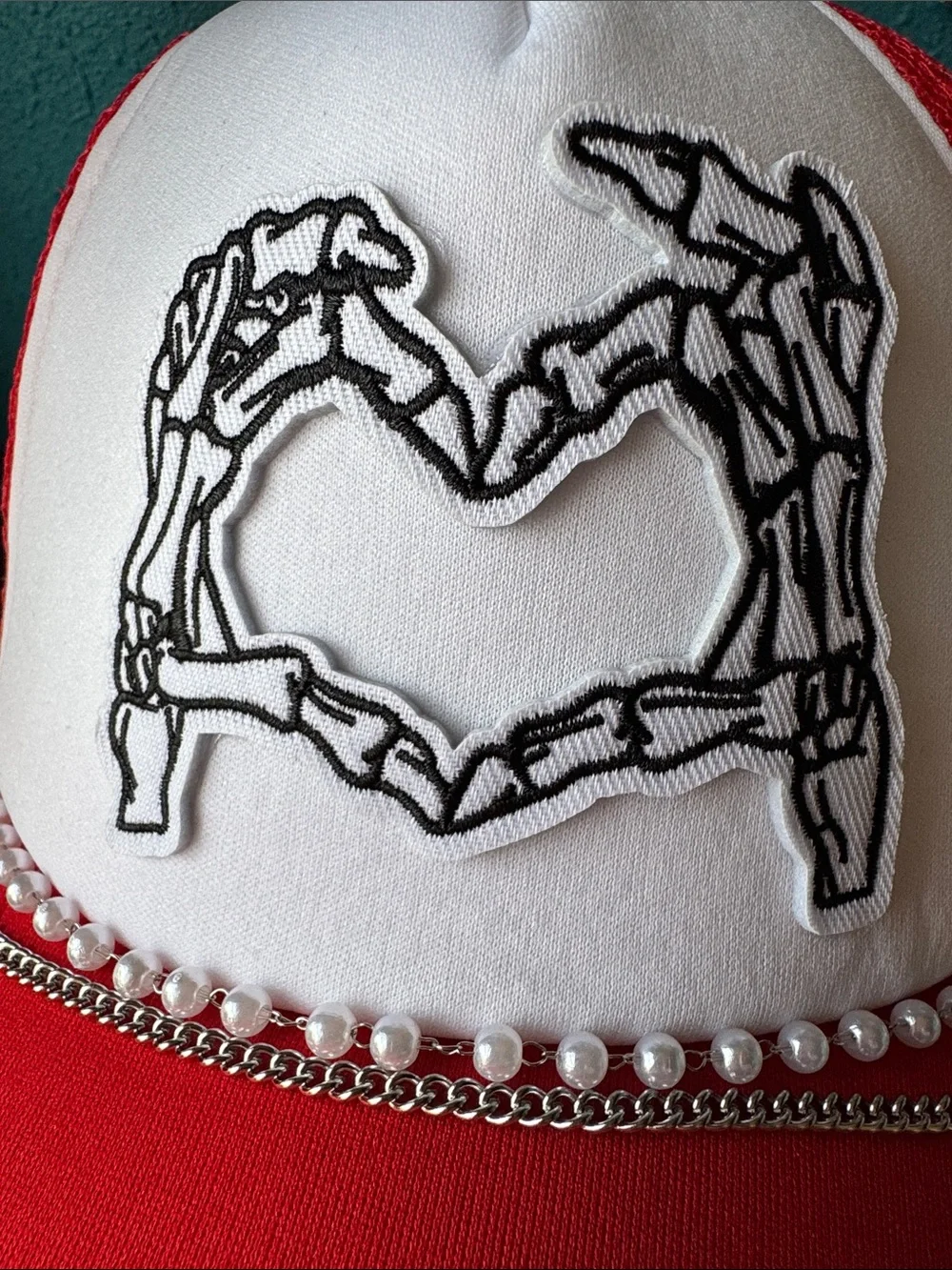 Red and White Trucker Hat with Skeleton Heart Patch